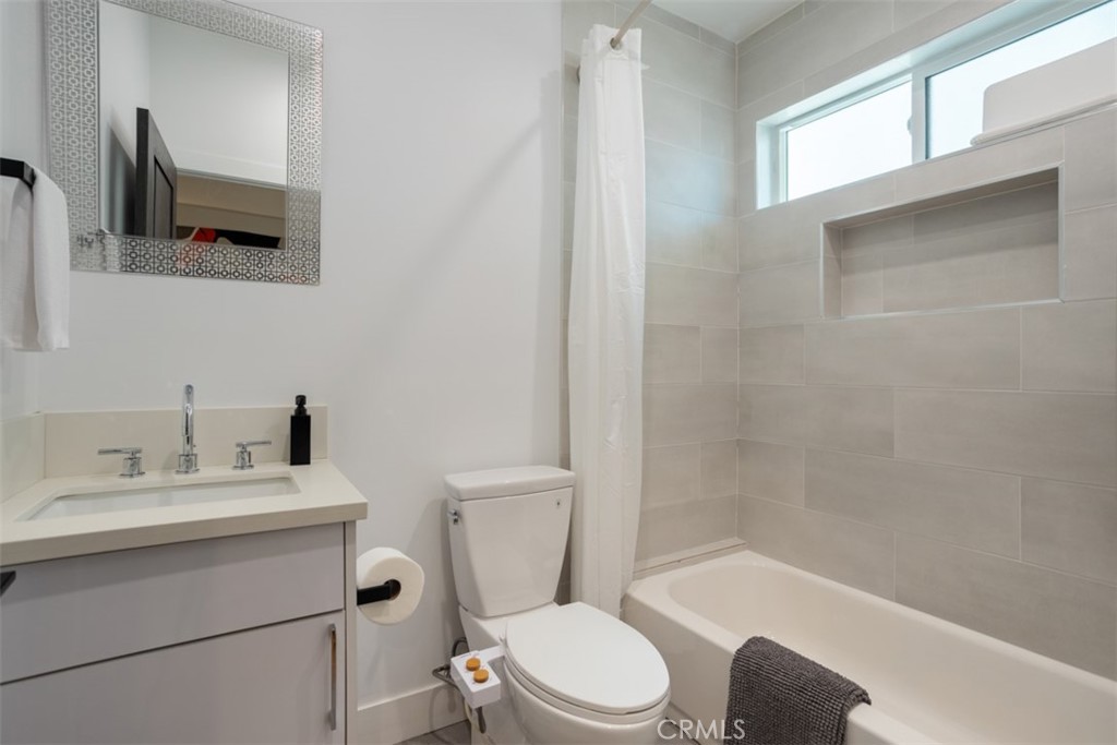 950 El Paso Drive Los Angeles, CA 90042 - Photo 35 of 52 a bathroom with a sink toilet and shower