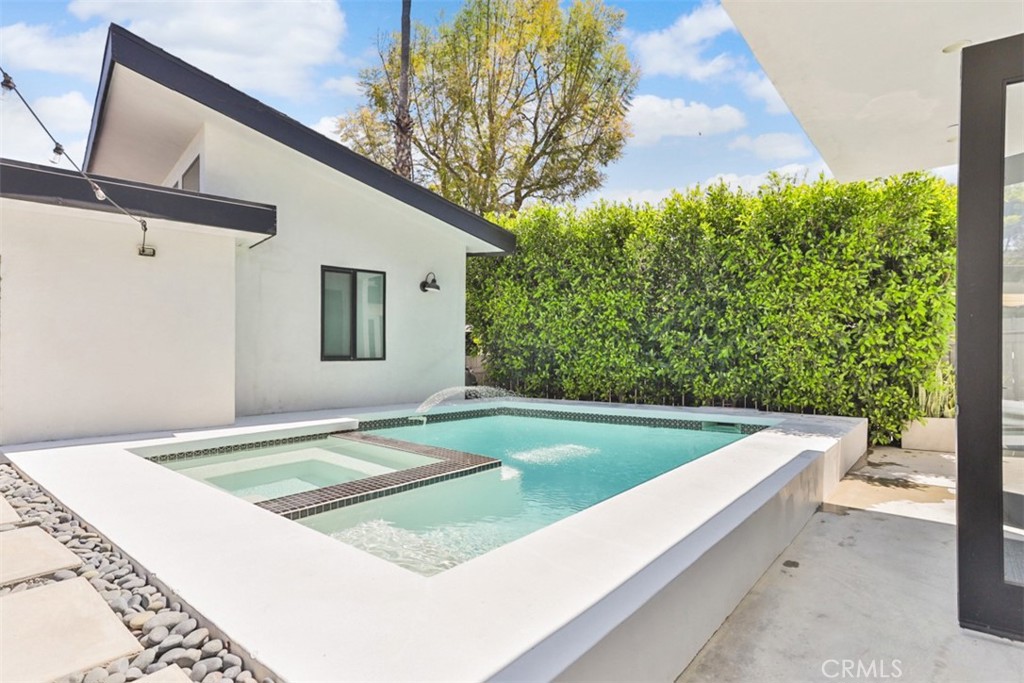 950 El Paso Drive Los Angeles, CA 90042 - Photo 39 of 52 a view of a swimming pool with a yard