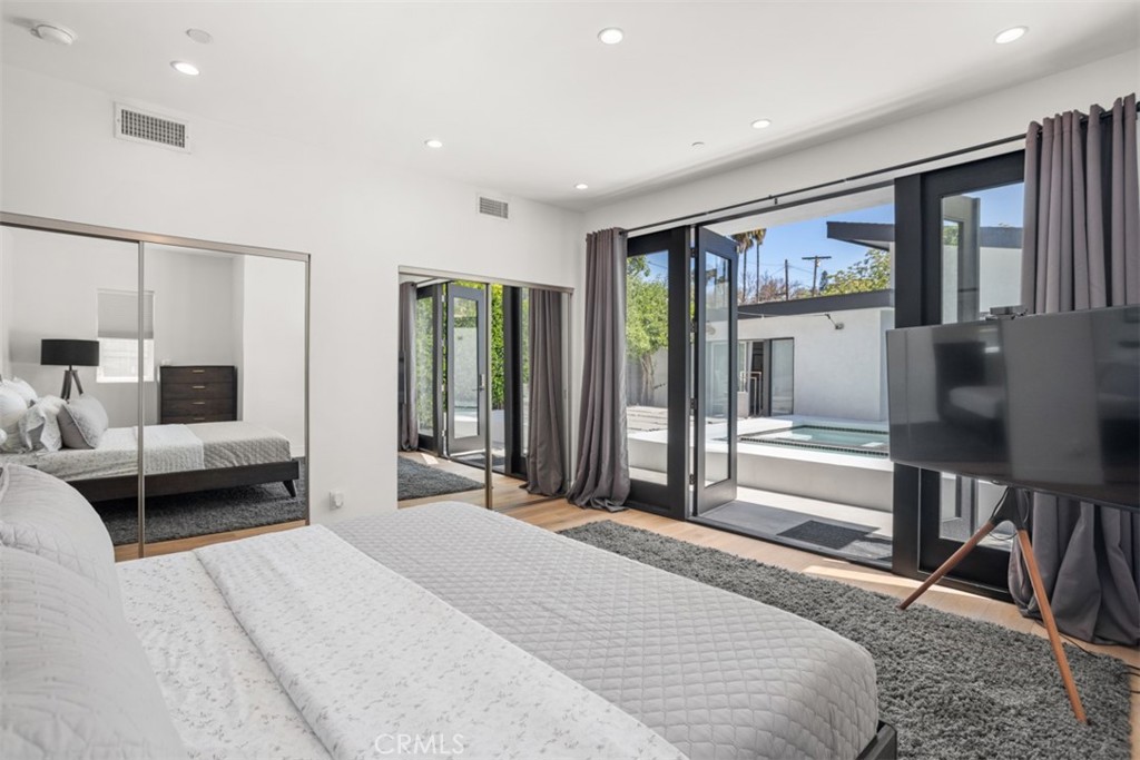 950 El Paso Drive Los Angeles, CA 90042 - Photo 4 of 52 a bedroom with a bed and a large window