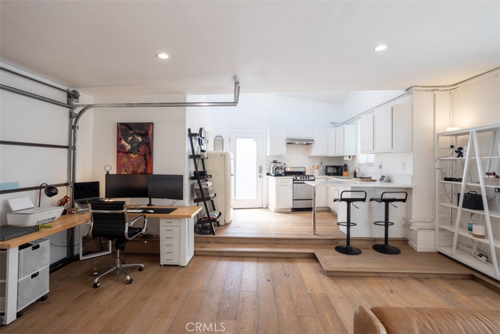 950 El Paso Drive Los Angeles, CA 90042 - Photo 43 of 52 a living room with lots of furniture and kitchen view