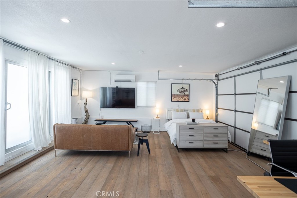 950 El Paso Drive Los Angeles, CA 90042 - Photo 44 of 52 a living room with furniture and a flat screen tv