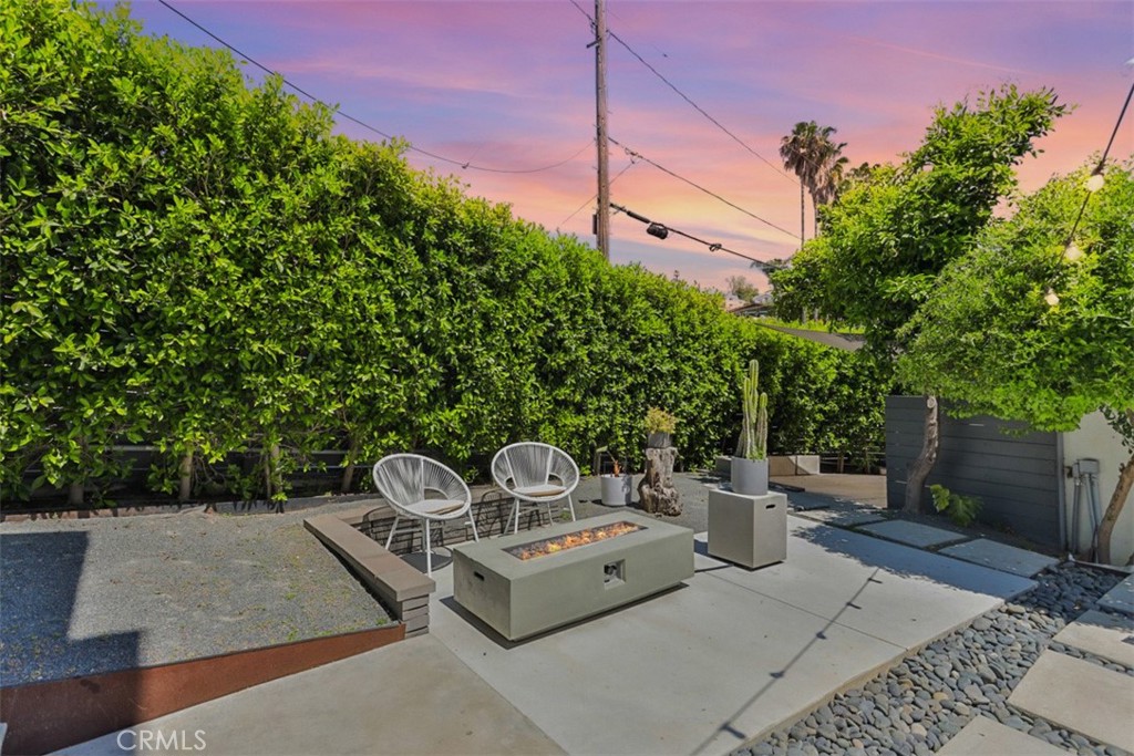 950 El Paso Drive Los Angeles, CA 90042 - Photo 48 of 52 a view of a chairs and table in the back yard of the house