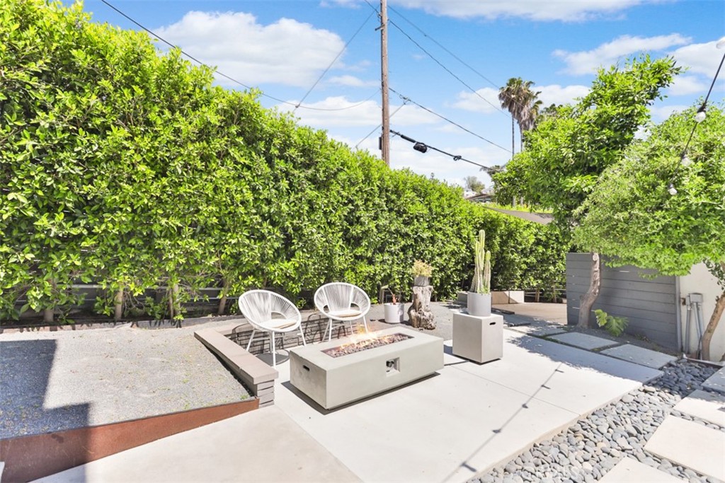 950 El Paso Drive Los Angeles, CA 90042 - Photo 49 of 52 a view of a patio with a table and chairs and a potted plant