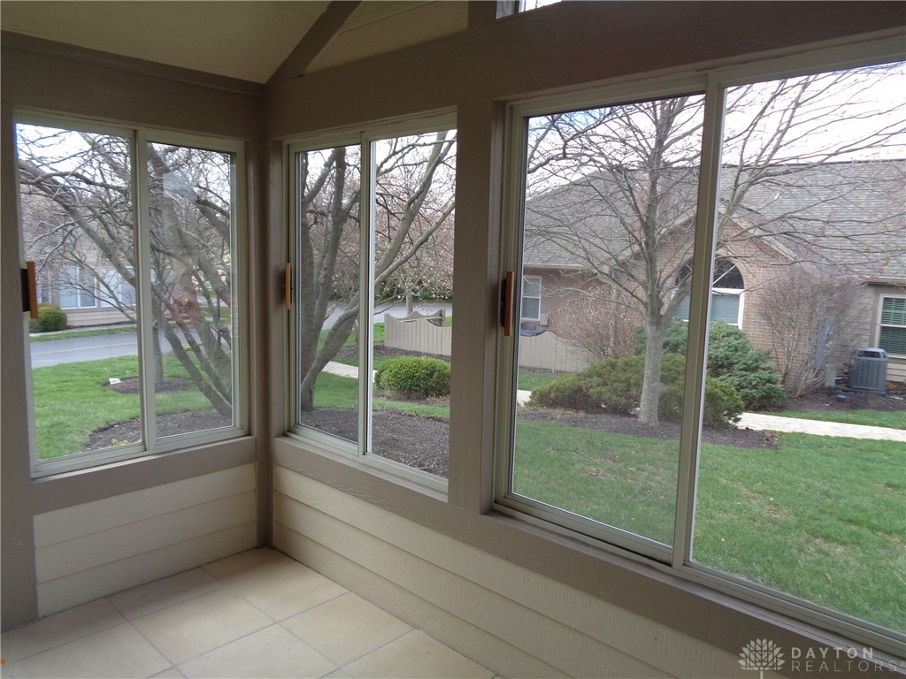 80 Villa Pointe Drive Springboro, OH 45066 - Photo 19 of 19 This sunlit space offers expansive views of the lush, well-maintained grounds.