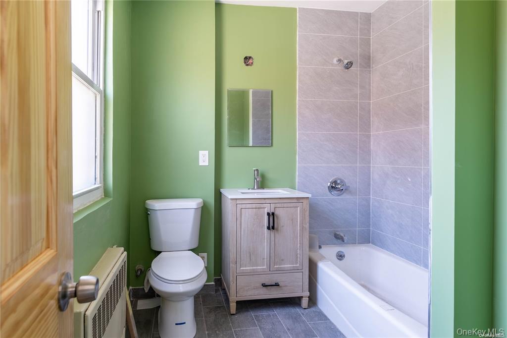 79-18 150th Street, Unit 3 Queens, NY 11367 - Photo 10 of 10 a bathroom with a sink toilet and bathtub