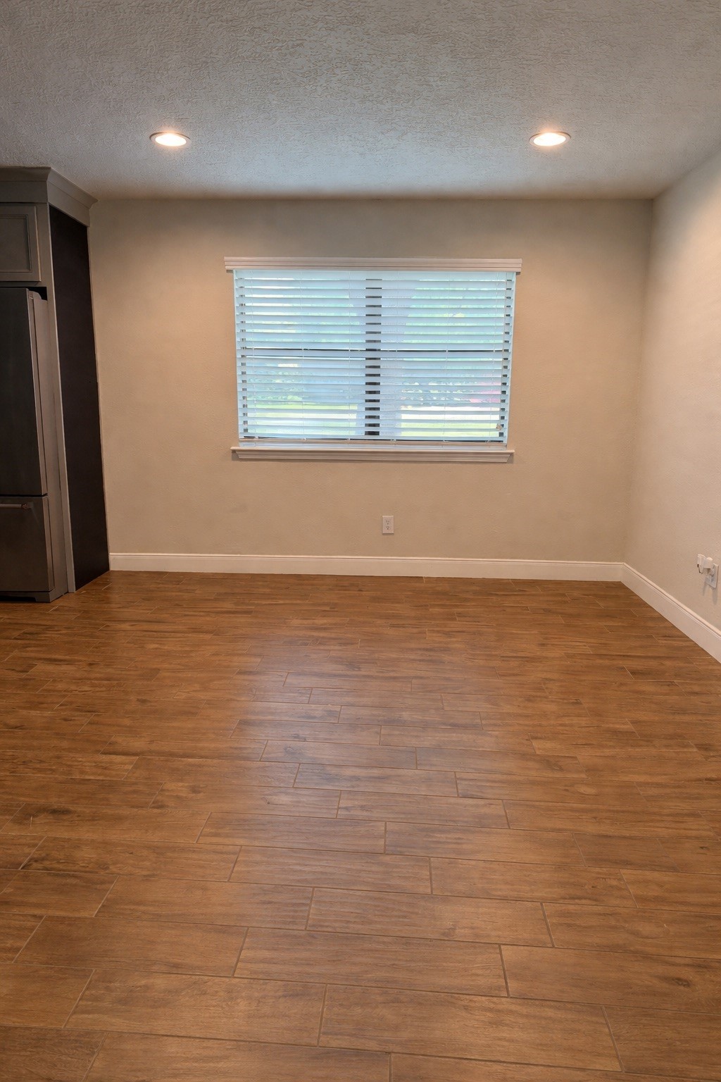 19103 Whitewood Drive Spring, TX 77373 - Photo 8 of 30 an empty room with wooden floor and windows