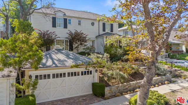 a view of a brick house with a yard