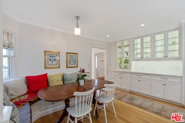 a view of a kitchen with granite countertop a sink and chandelier