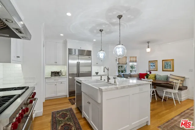 a bathroom with a sink a mirror a toilet and a shower