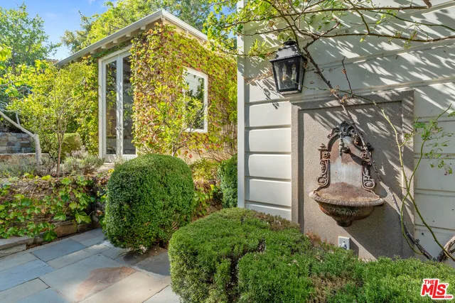 a view of a chairs and table in the patio