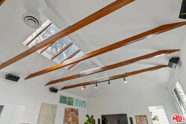 a front view of a house with plants