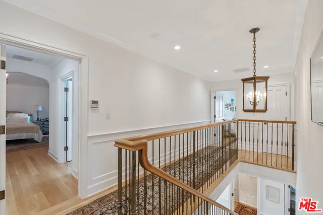 a view of a workspace with furniture and a flat screen tv