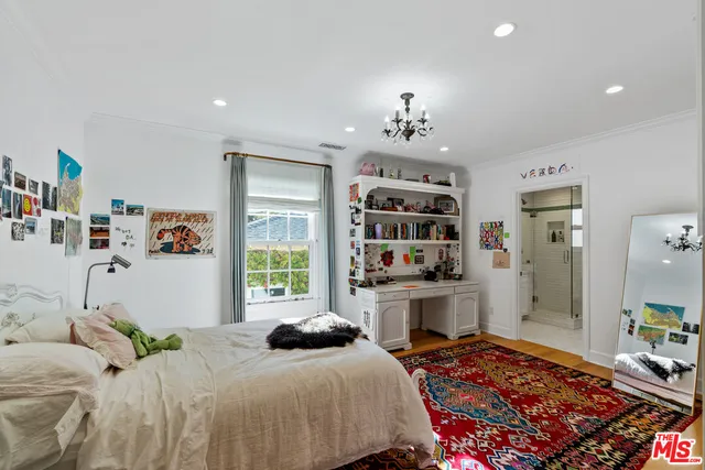 a bathroom with a bathtub sink vanity and mirror