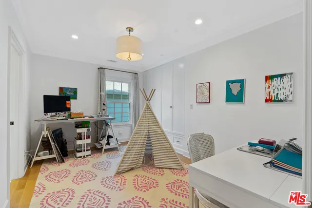 a spacious bathroom with a tub sink and mirror