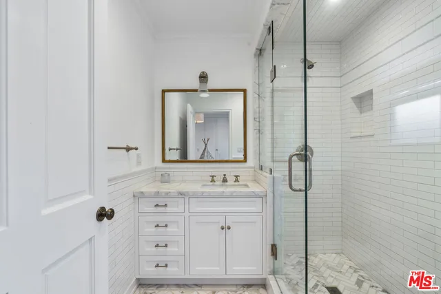 a bathroom with a bathtub and a shower