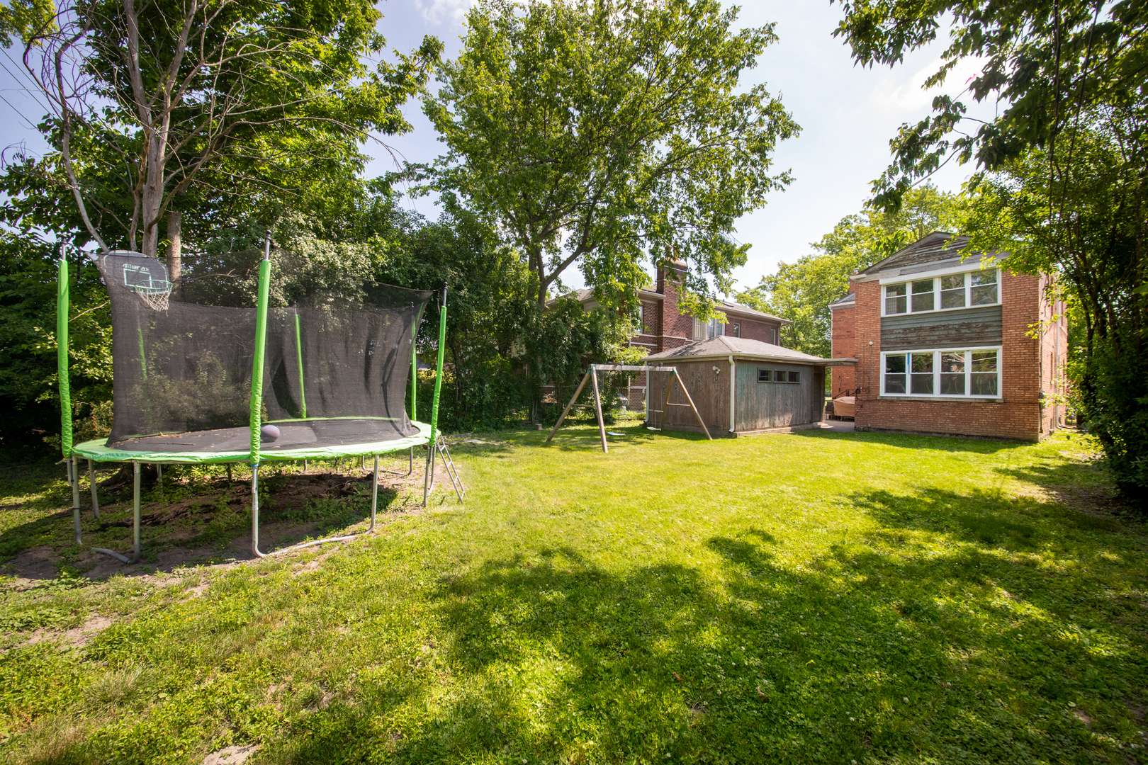 516 Engel Boulevard Park Ridge, IL 60068 - Photo 18 of 51 a view of a swimming pool with a bench and trees