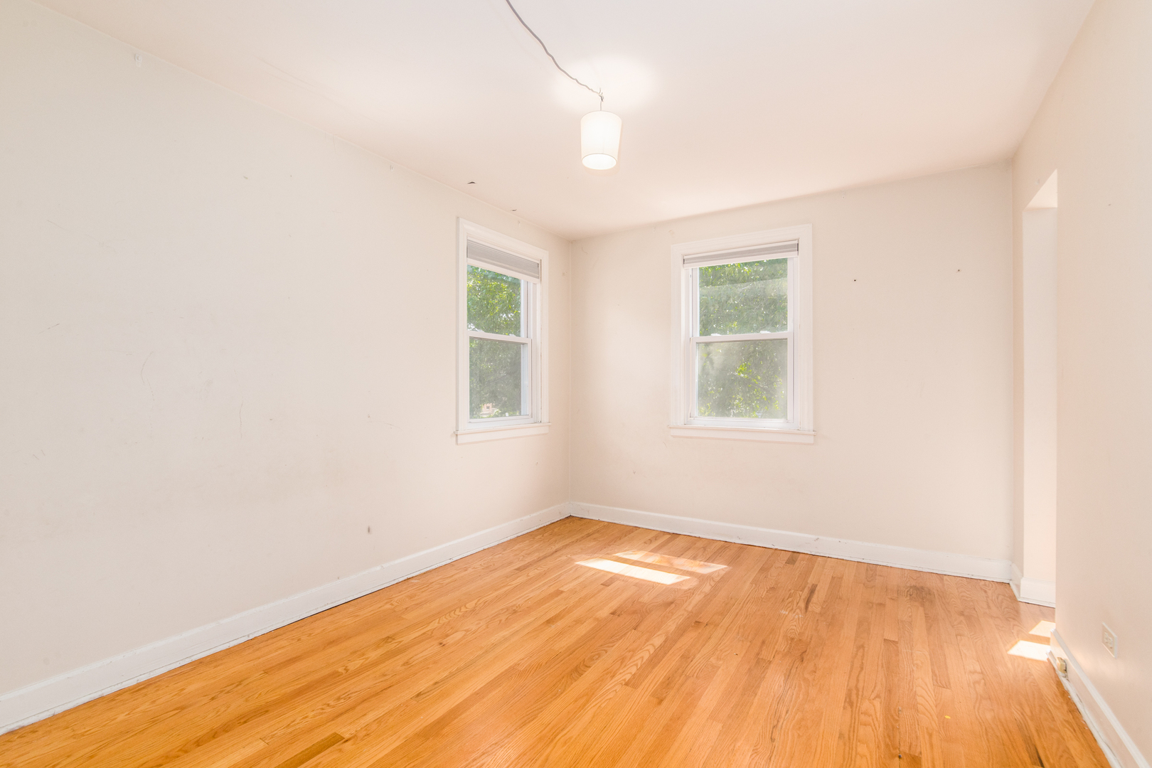 516 Engel Boulevard Park Ridge, IL 60068 - Photo 45 of 51 an empty room with wooden floor and windows