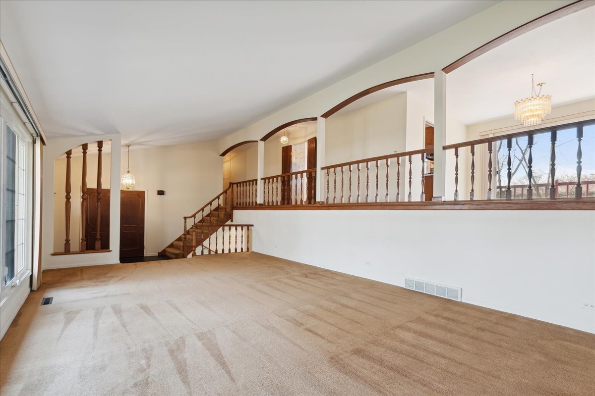 962 Suffield Terrace Northbrook, IL 60062 - Photo 5 of 33 a view of an empty room with stairs