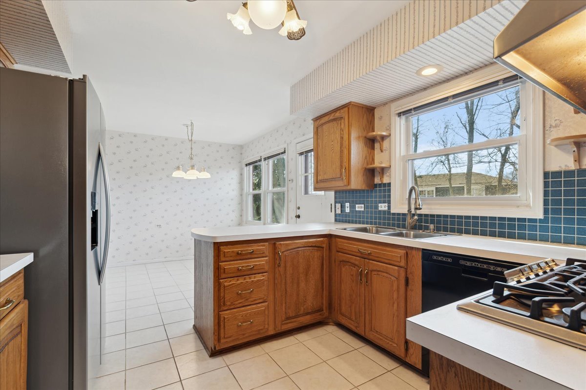 962 Suffield Terrace Northbrook, IL 60062 - Photo 8 of 33 a kitchen with a sink stove and cabinets