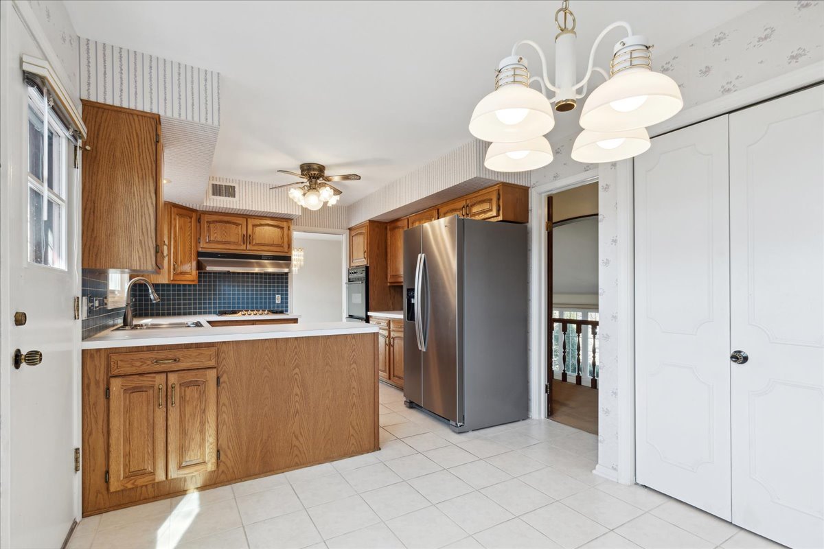962 Suffield Terrace Northbrook, IL 60062 - Photo 10 of 33 a view of a kitchen with a sink stainless steel appliances and cabinets