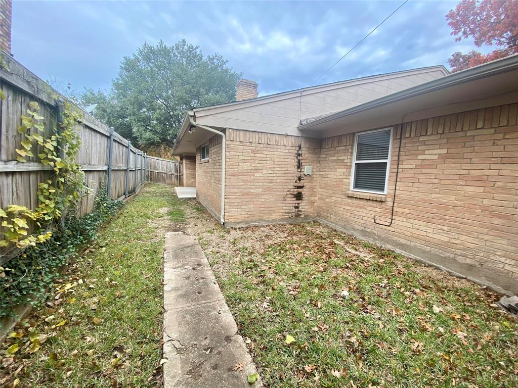 7406 Walling Lane Dallas, TX 75231 - Photo 14 of 15 a backyard of a house with lots of green space
