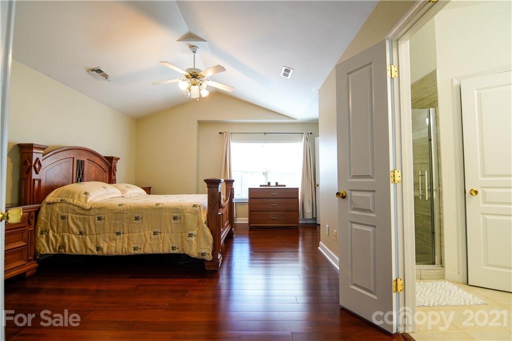2318 Mirage Place Fort Mill, SC 29708 - Photo 15 of 27 a bedroom with a bed and wooden floor