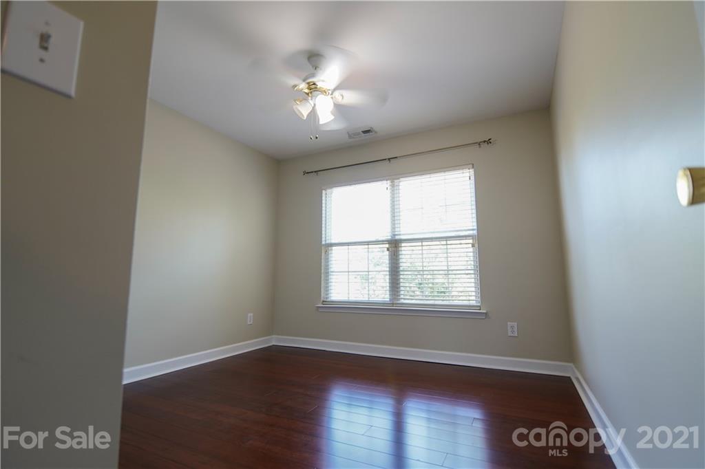 2318 Mirage Place Fort Mill, SC 29708 - Photo 19 of 27 an empty room with wooden floor and windows