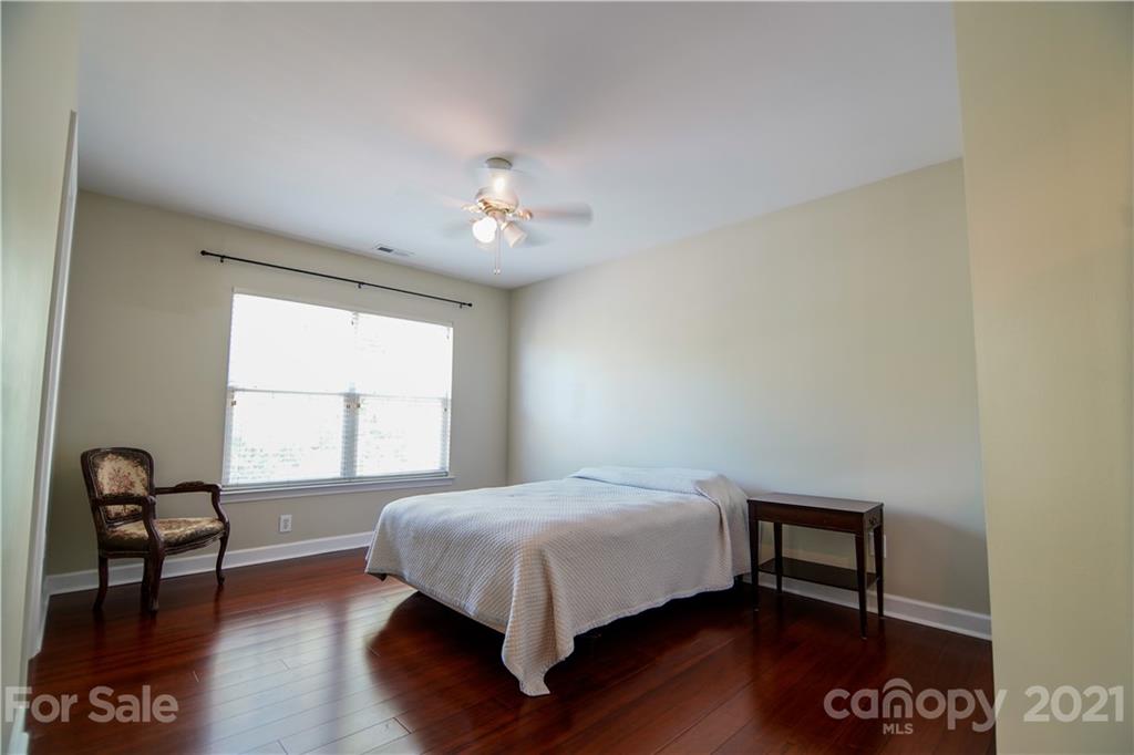2318 Mirage Place Fort Mill, SC 29708 - Photo 20 of 27 a bedroom with a bed and a table in it