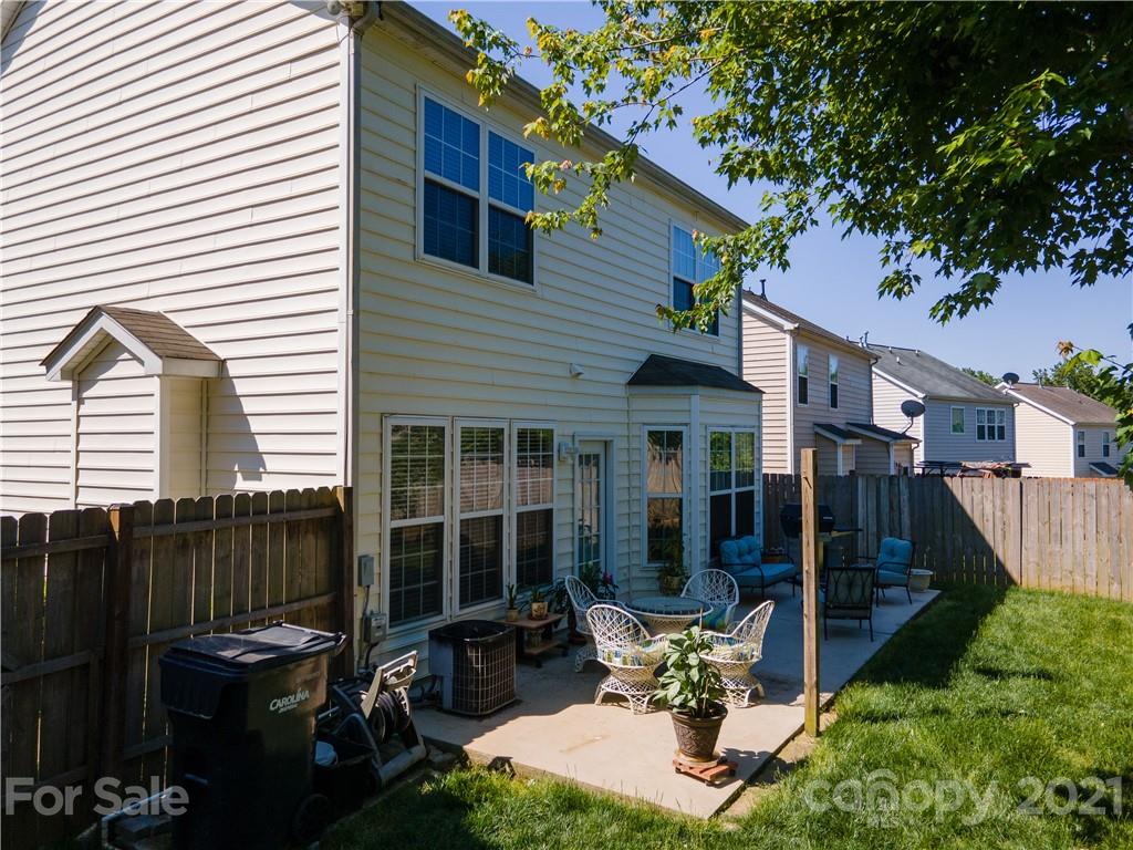 2318 Mirage Place Fort Mill, SC 29708 - Photo 27 of 27 a view of a patio with table and chairs and potted plants