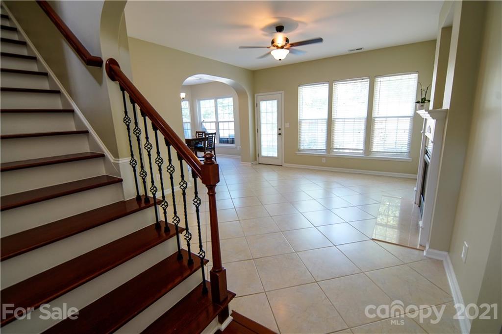 2318 Mirage Place Fort Mill, SC 29708 - Photo 7 of 27 a view of an entryway with wooden floor and a chandelier