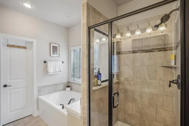 a bathroom with double vanity sinks and a mirror