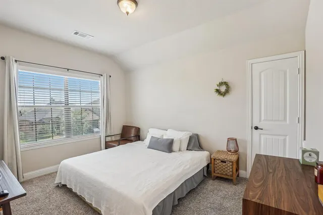 a bathroom with double vanity sinks and a mirror