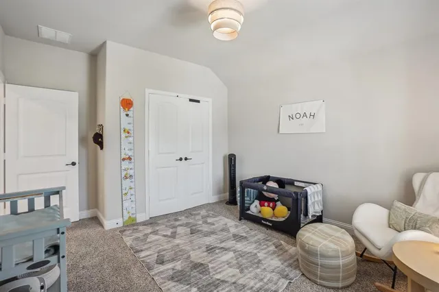 a living room with furniture a chandelier and a window