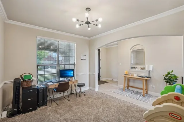 a living room with furniture and a table