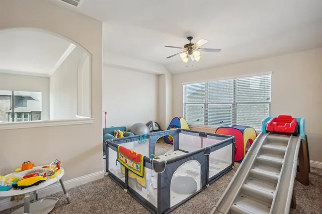 a bedroom with furniture and a window