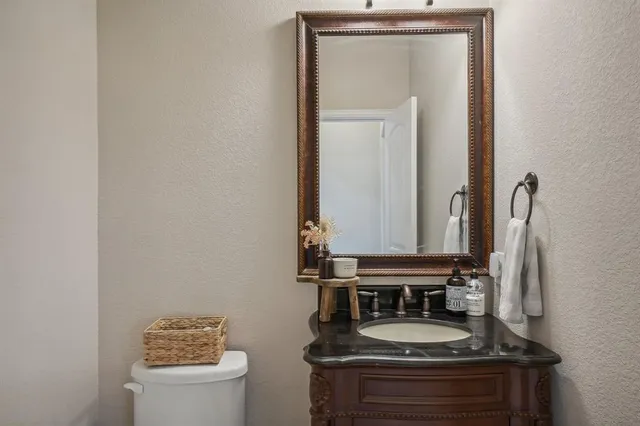 a view of a house with backyard porch and sitting area
