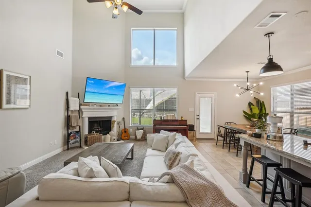 a living room with furniture kitchen view and a dining table