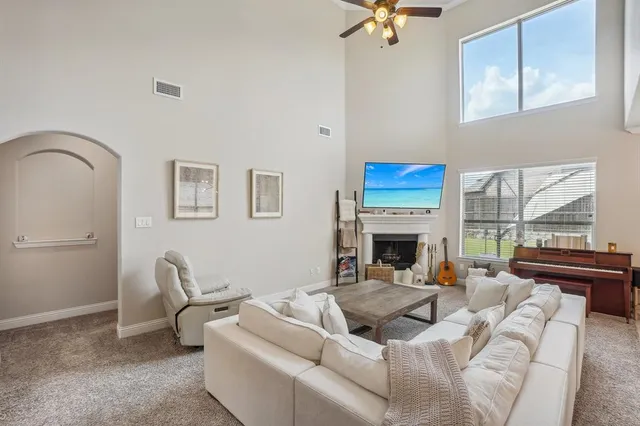 a kitchen with a sink a stove and chairs