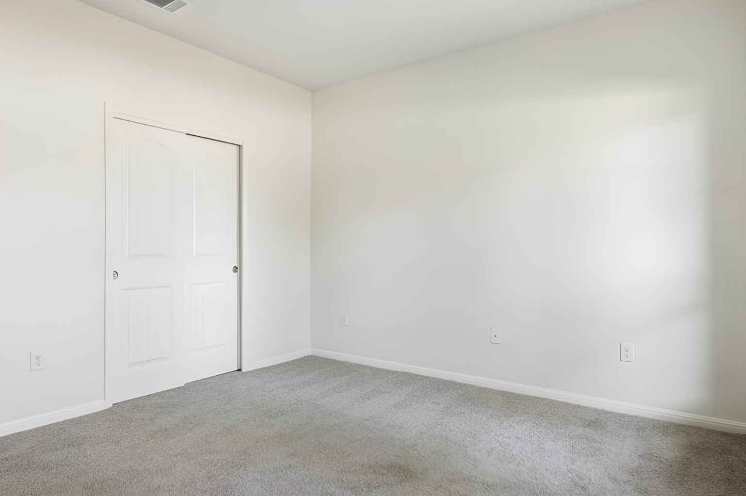 304 Santa Maria Street Georgetown, TX 78628 - Photo 12 of 37 A well-proportioned bedroom with fresh carpeting and a practical sliding door closet awaits personalization.