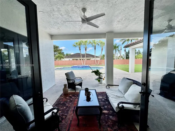 a view of a dining room with furniture window and outside view