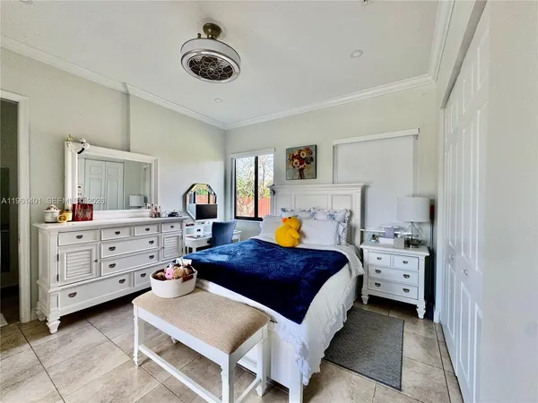 a bedroom with a bed and a cabinets
