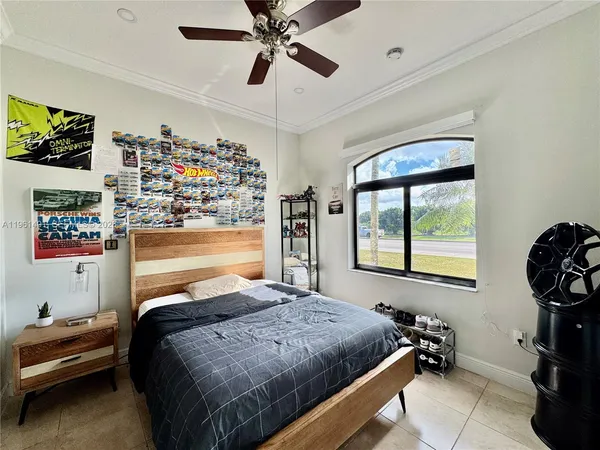 a bedroom with a bed and a window