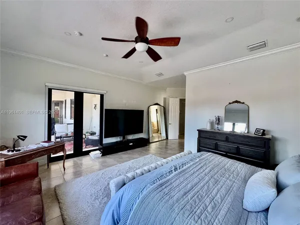 a bedroom with bed and window