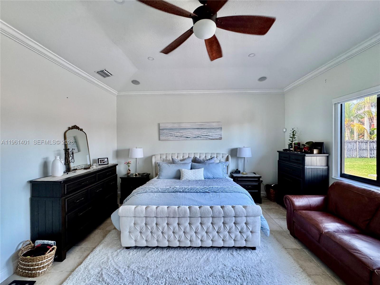 20449 Southwest 328th Street Homestead, FL 33030 - Photo 32 of 34 a bedroom with a bed and wooden floor