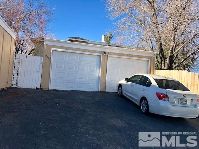 a view of a car in front of a house
