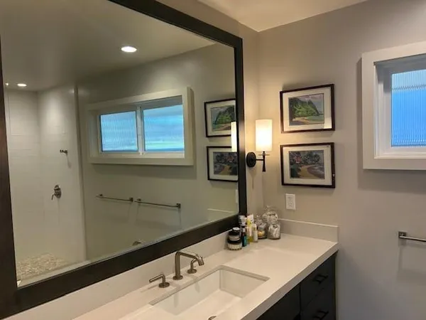 a bathroom with a sink and a mirror