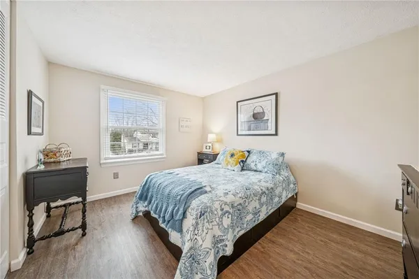 a bedroom with a bed and a table in it