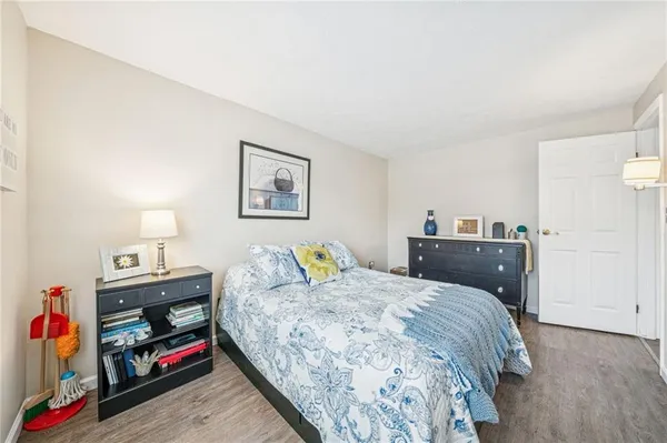 a bedroom with a bed and a closet