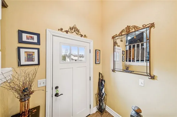 a bathroom with a sink and mirror with painted walls