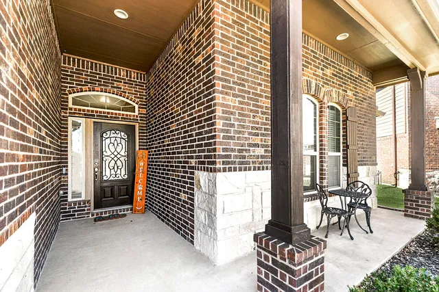a view of front door with wooden floor
